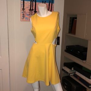Yellow dot and flare cut out dress